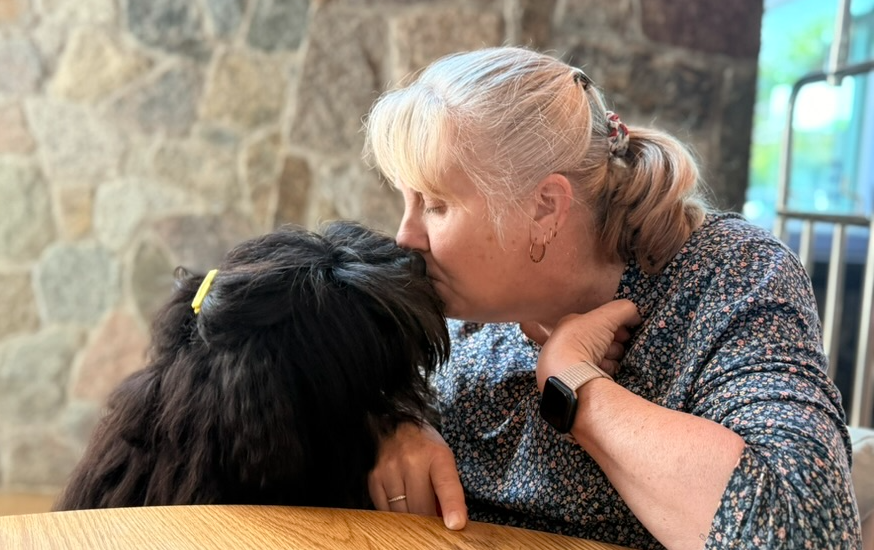 Elliott getting a kiss from Claire Stuchbury